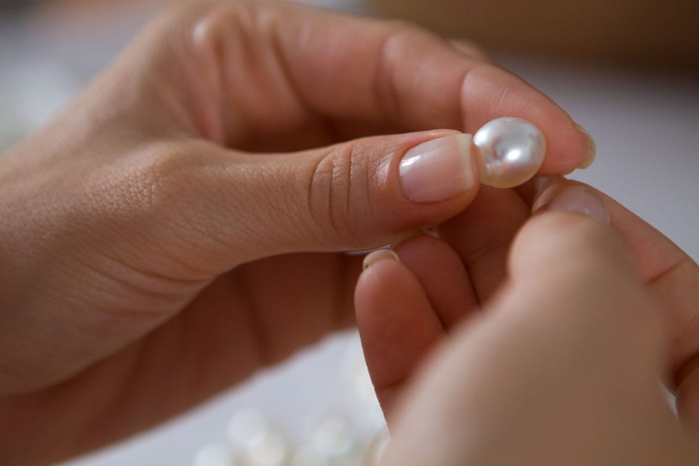 lady holding beautiful pearl