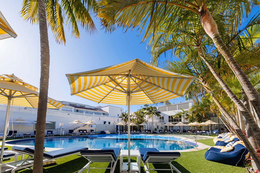 Chaise under an umbrella at Ramada Resort by Wyndham Shoal Bay Pool Area