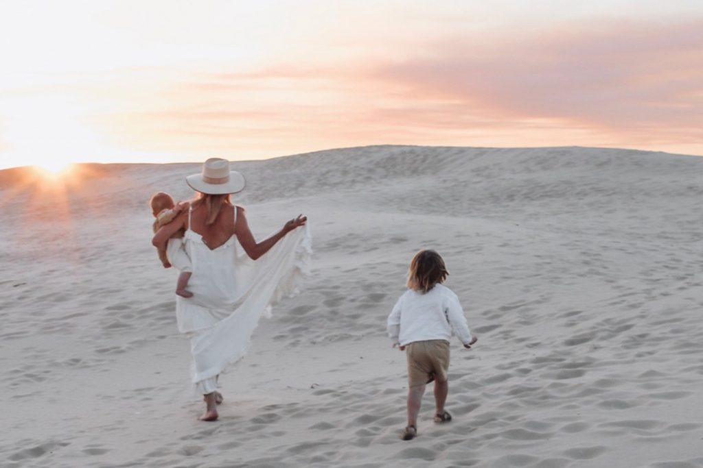 Mother and Kids walking at sandy Shoal Bay